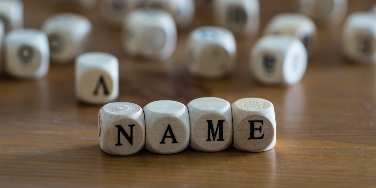 Scrabble blocks spelling 'name'.