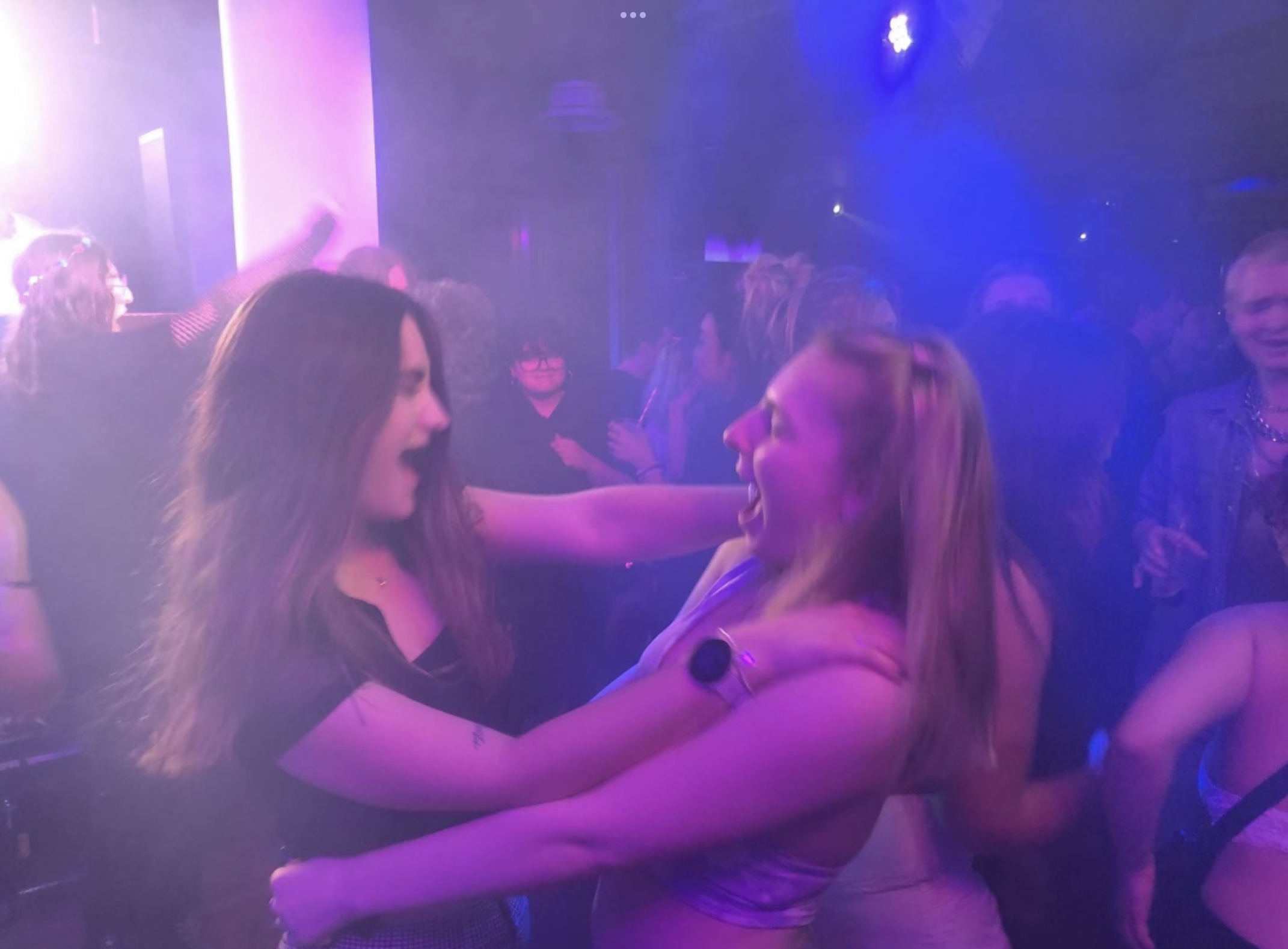 Two girls dancing in a LGBTQ+ nightclub